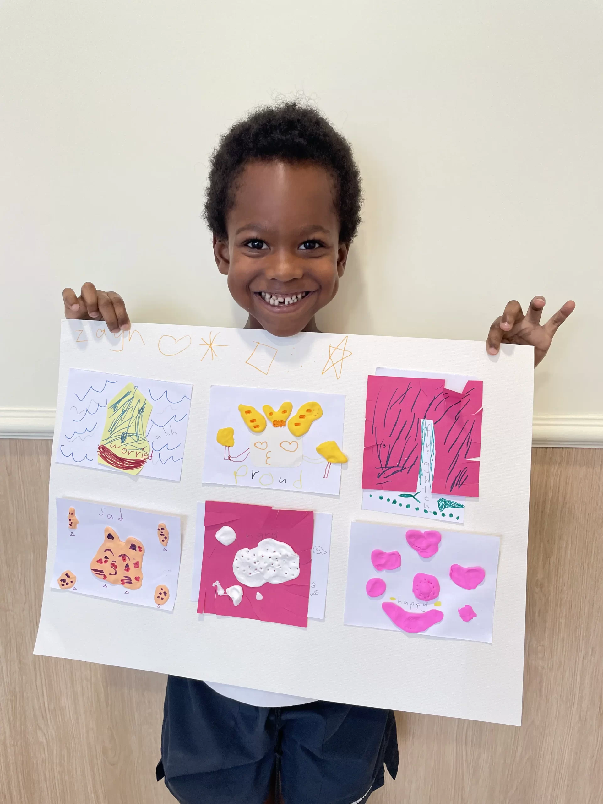 A child at the moodboard check-in at Sapling Grove